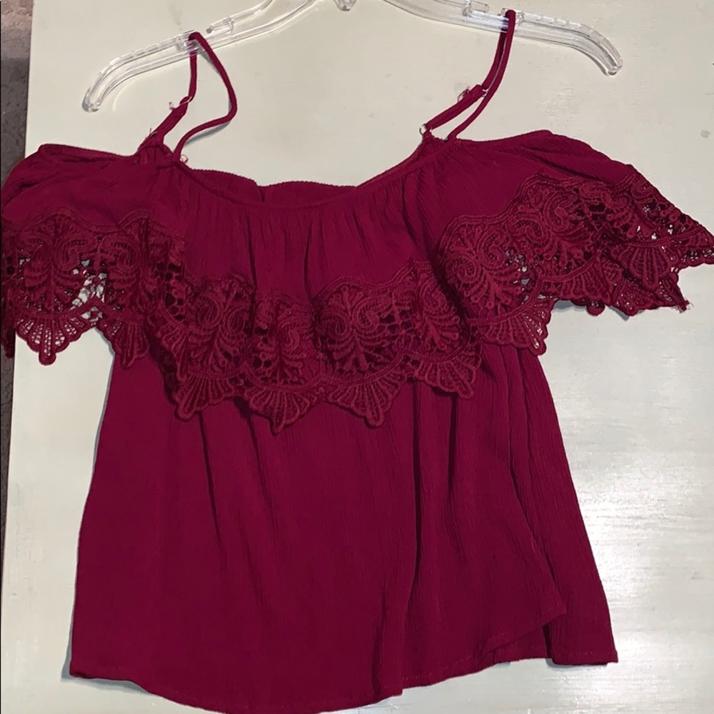 A red spaghetti strap crop top.
